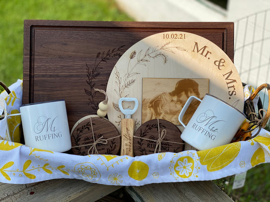 Personalized wedding gift set with a black walnut cutting board engraved with the couple's names